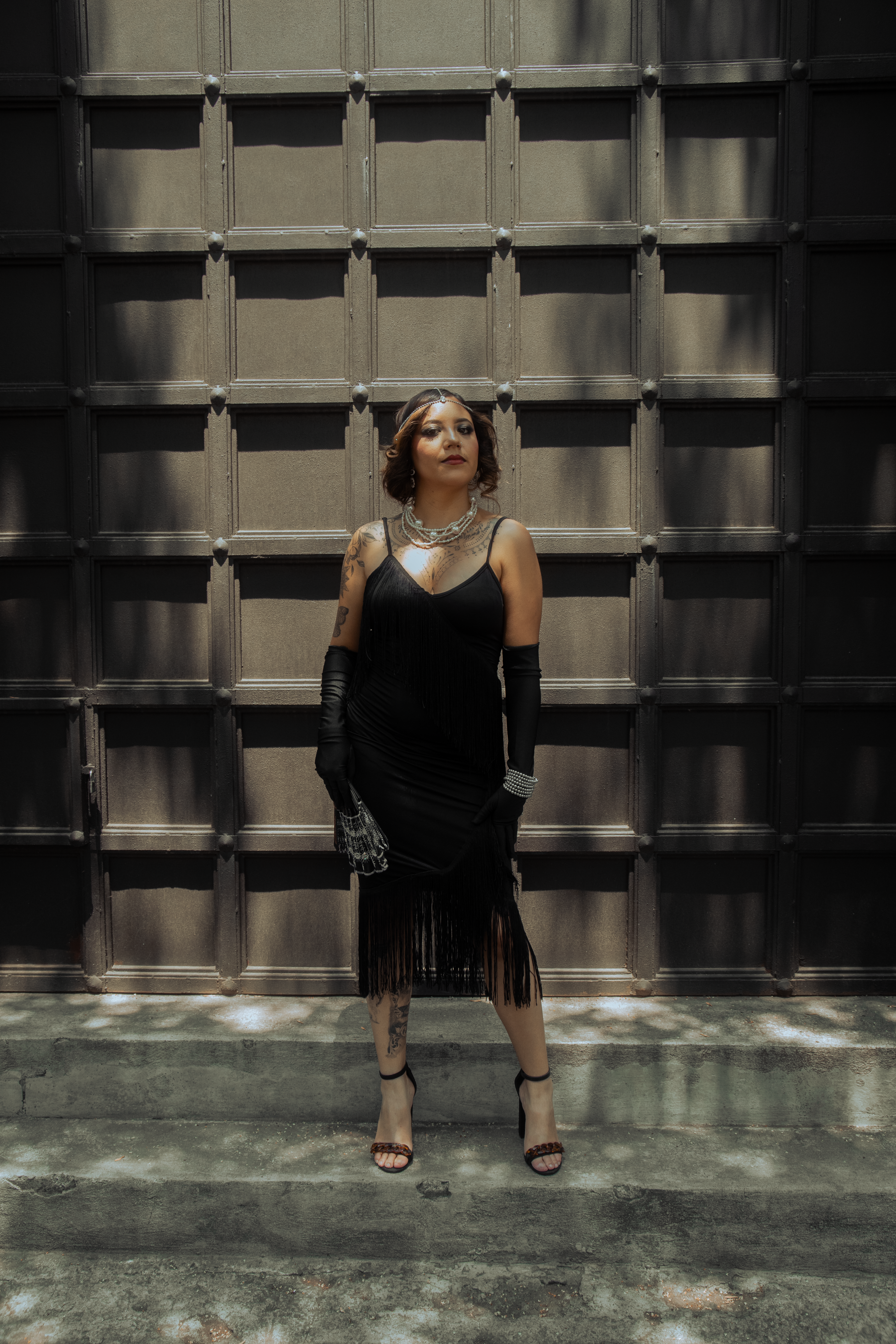 Woman Posing in Black Dress on a Street · Free Stock Photo