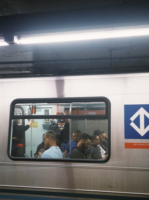 A subway train with people on it