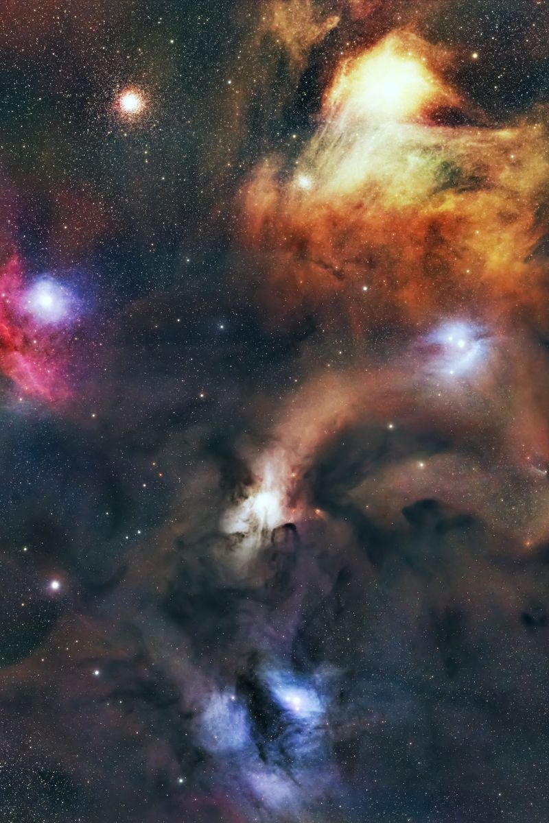 Vibrant image of cosmic dust and celestial bodies in space, featuring colorful nebulas.