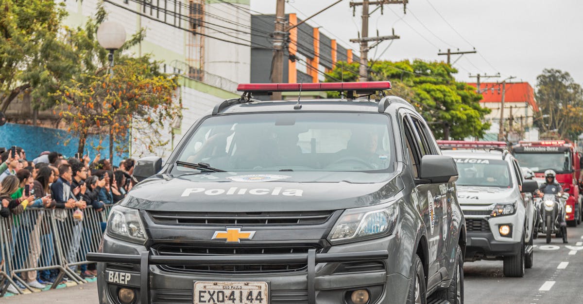 Police Cars in Parade on Street · Free Stock Photo