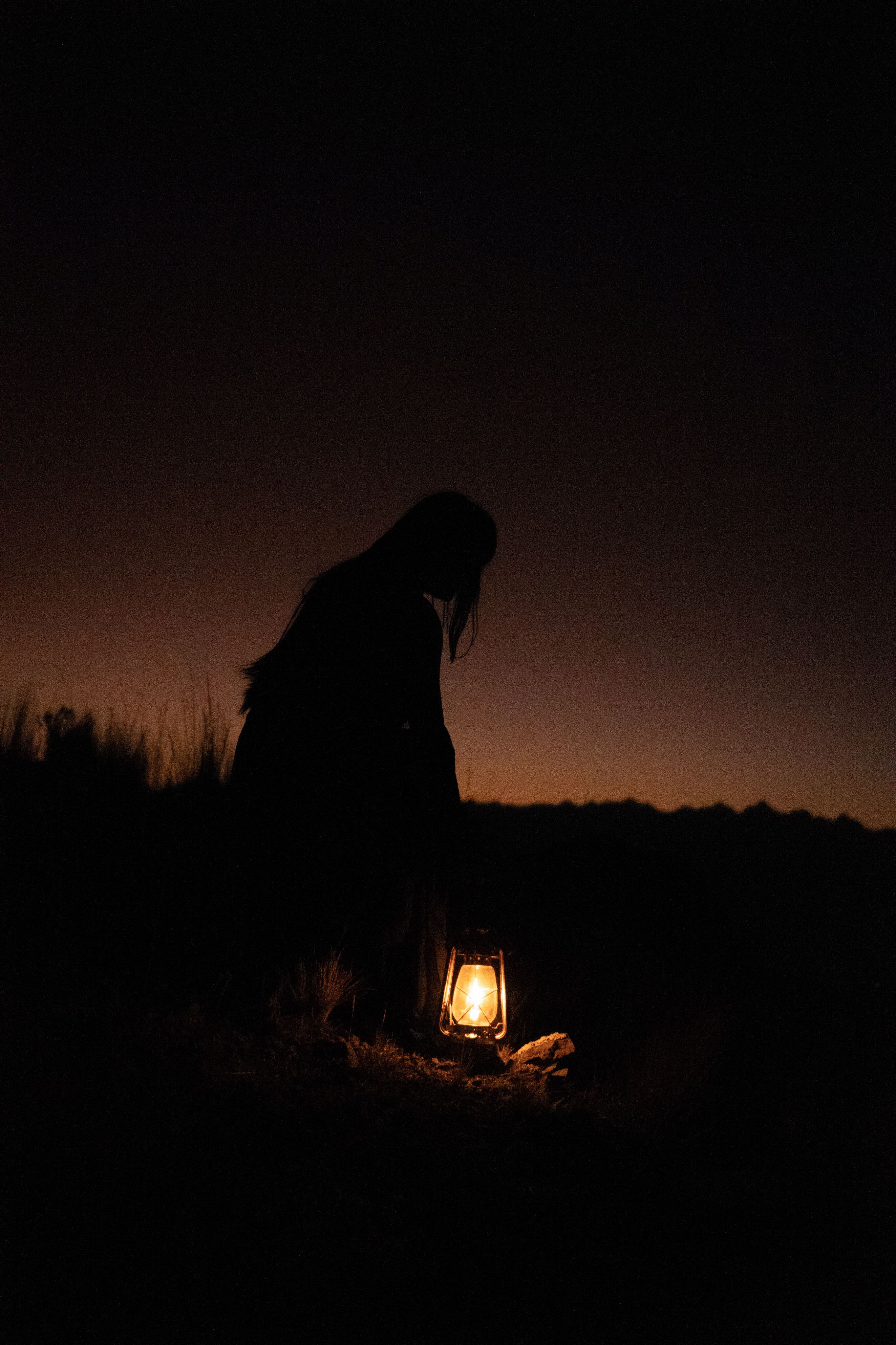 Silhouette of Woman with Lantern · Free Stock Photo