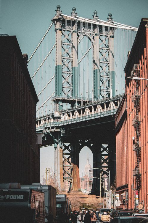 Free Vertical shot of the Manhattan Bridge with New York City skyline in the background, captured from Dumbo, Brooklyn. Stock Photo