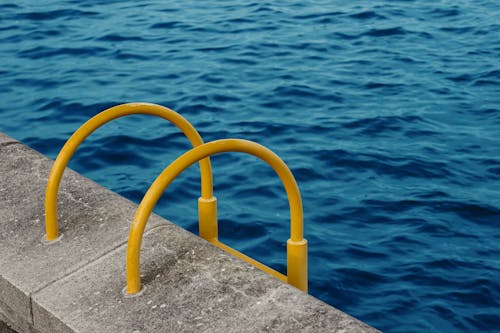 Yellow handrail for swimming pool