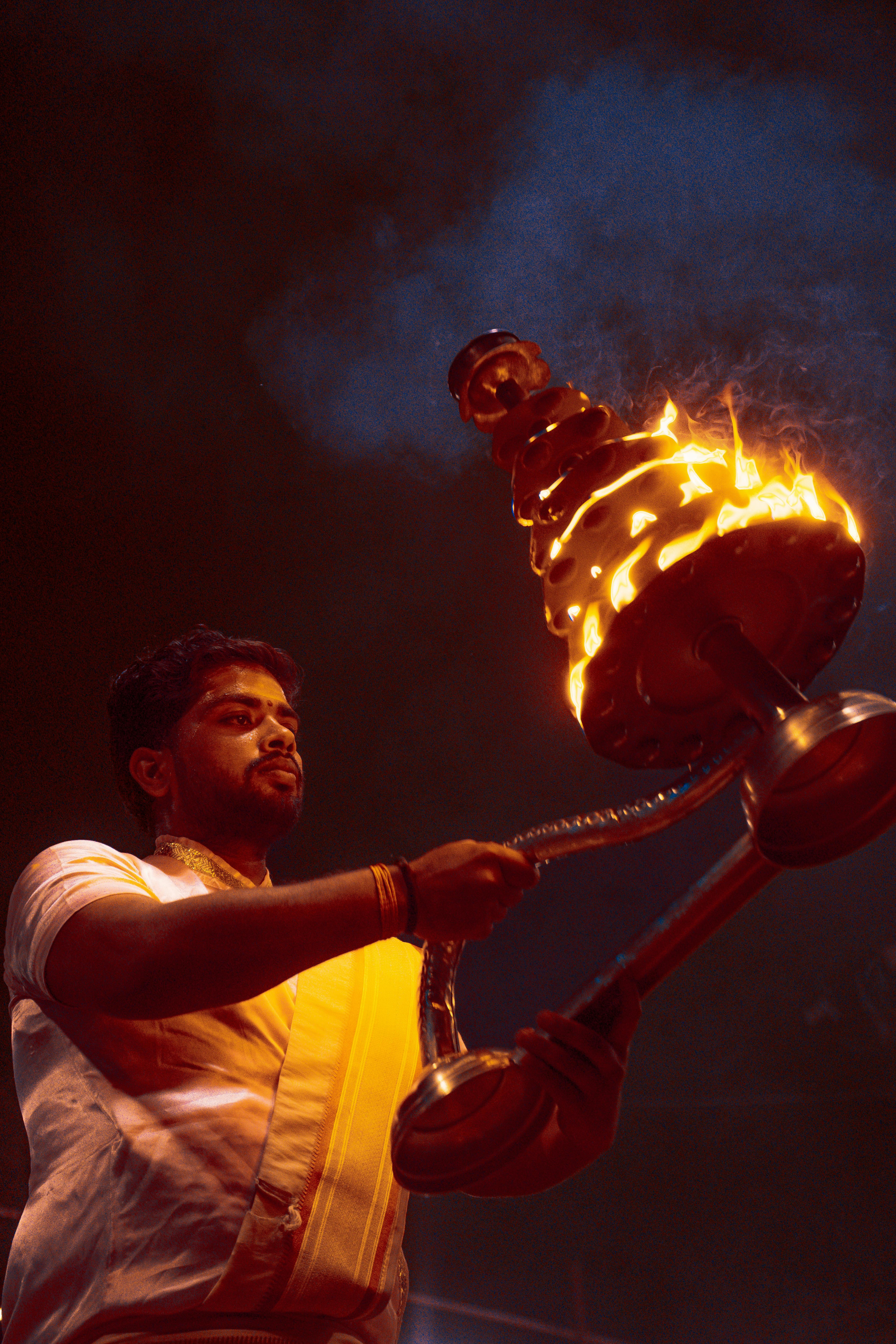 man holding burning tower