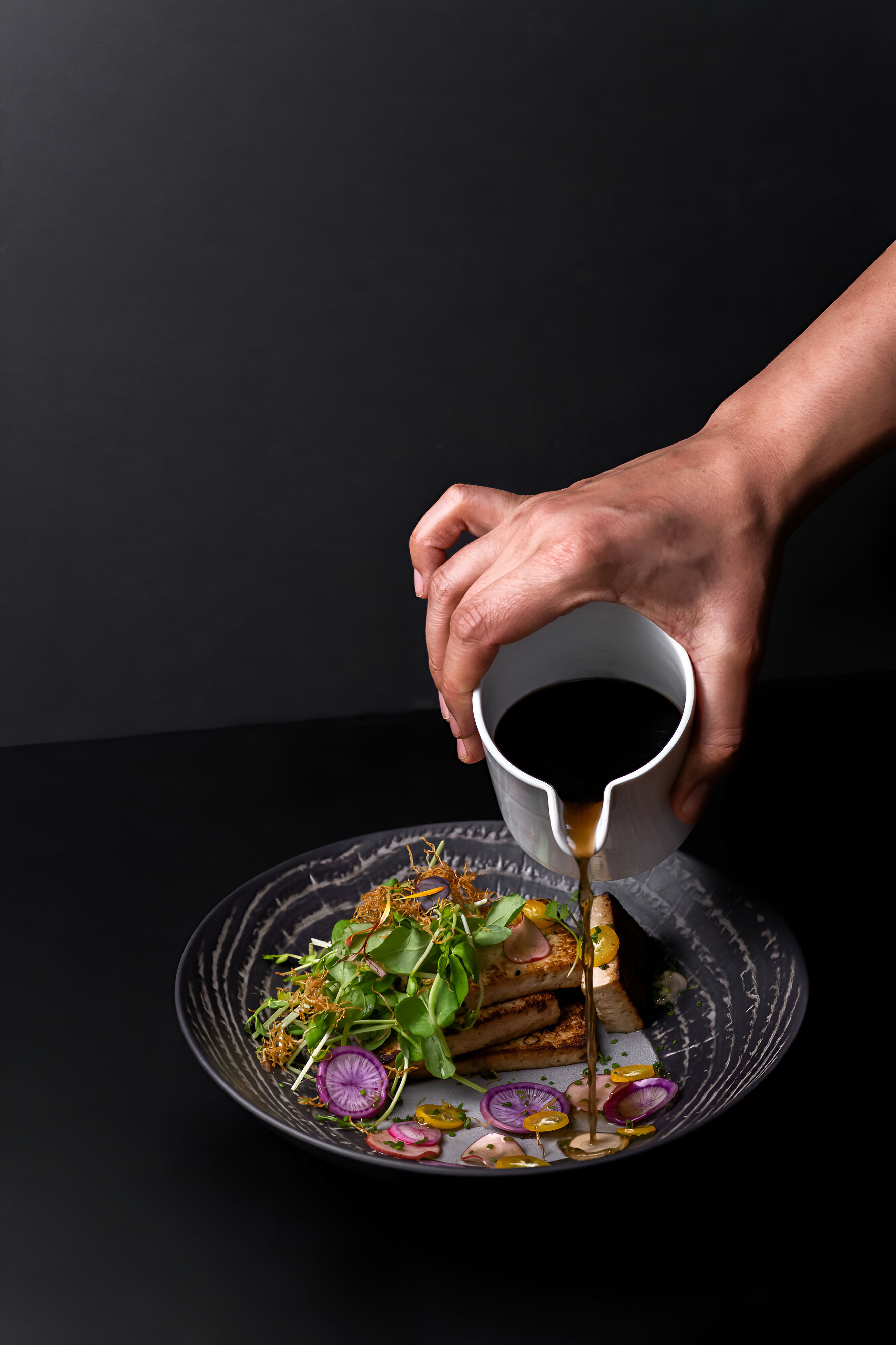 Sauce poured over a plated dish