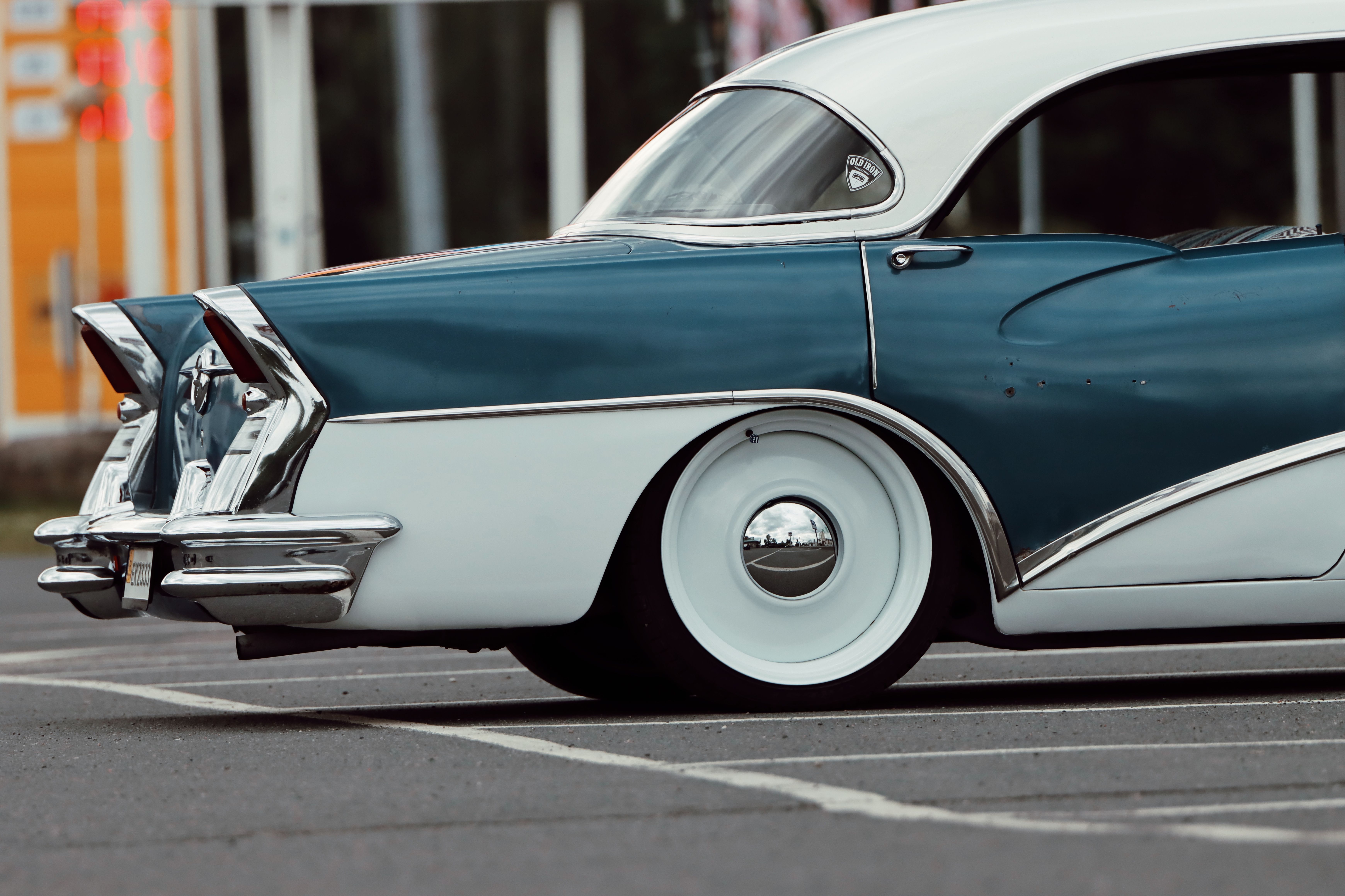 Blue and white vintage Buick with elegant styling outdoors.