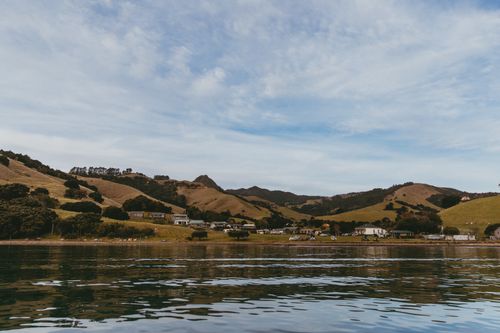 Free Explore the tranquil coastline and rolling hills of Kereta, Waikato, New Zealand. Stock Photo