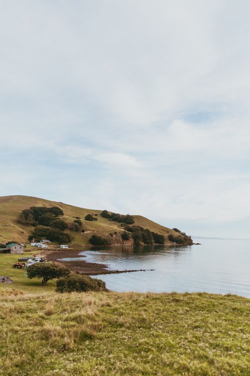 Free Picturesque coastline at Kereta, Waikato, New Zealand highlighting rural serenity and natural beauty. Stock Photo