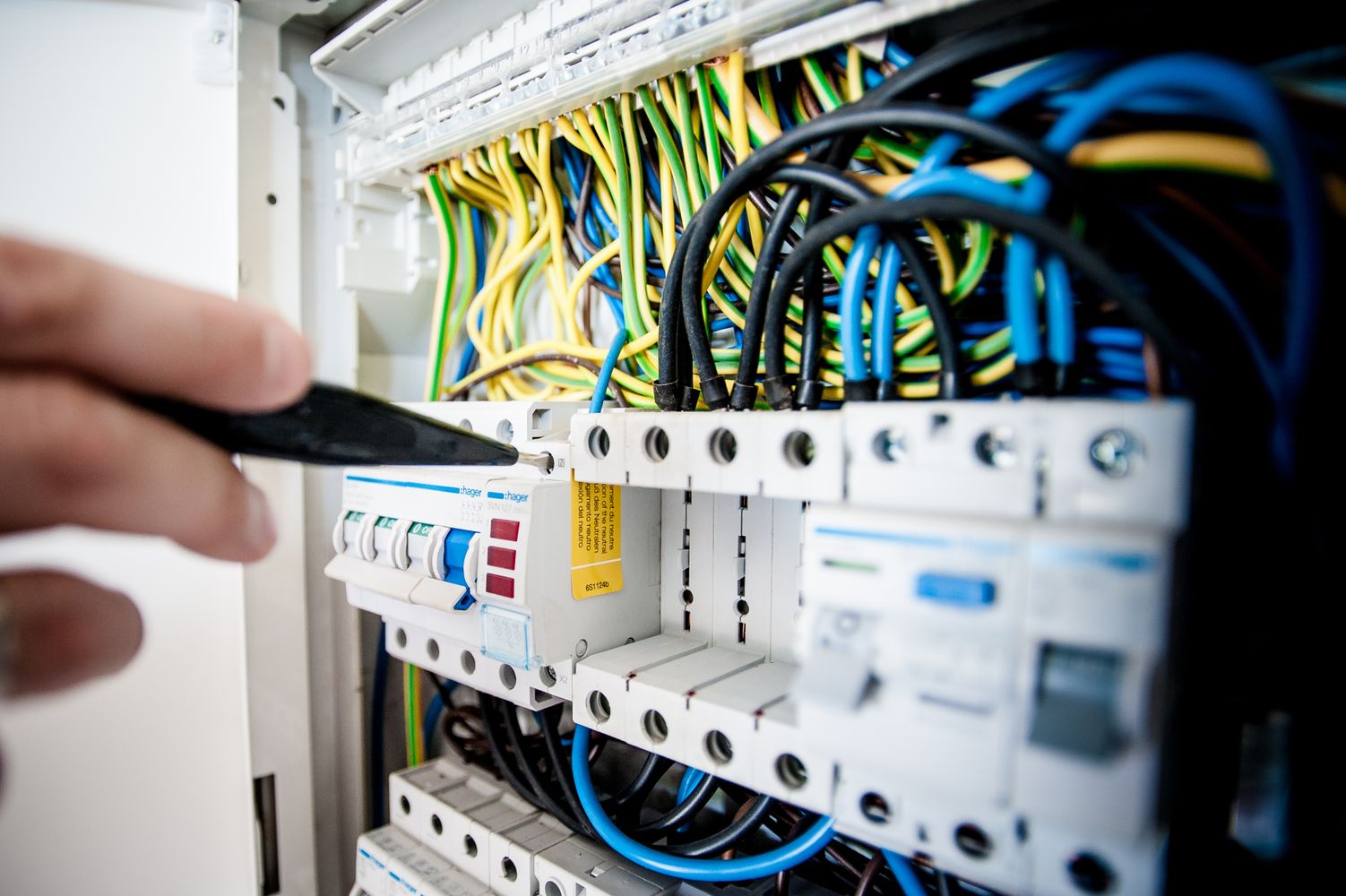 NICEIC electrician carrying out an EICR inspection on a consumer unit in Newham