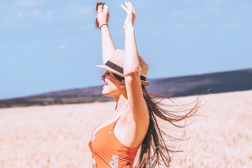 Photo of Woman Raising Her Both Arms