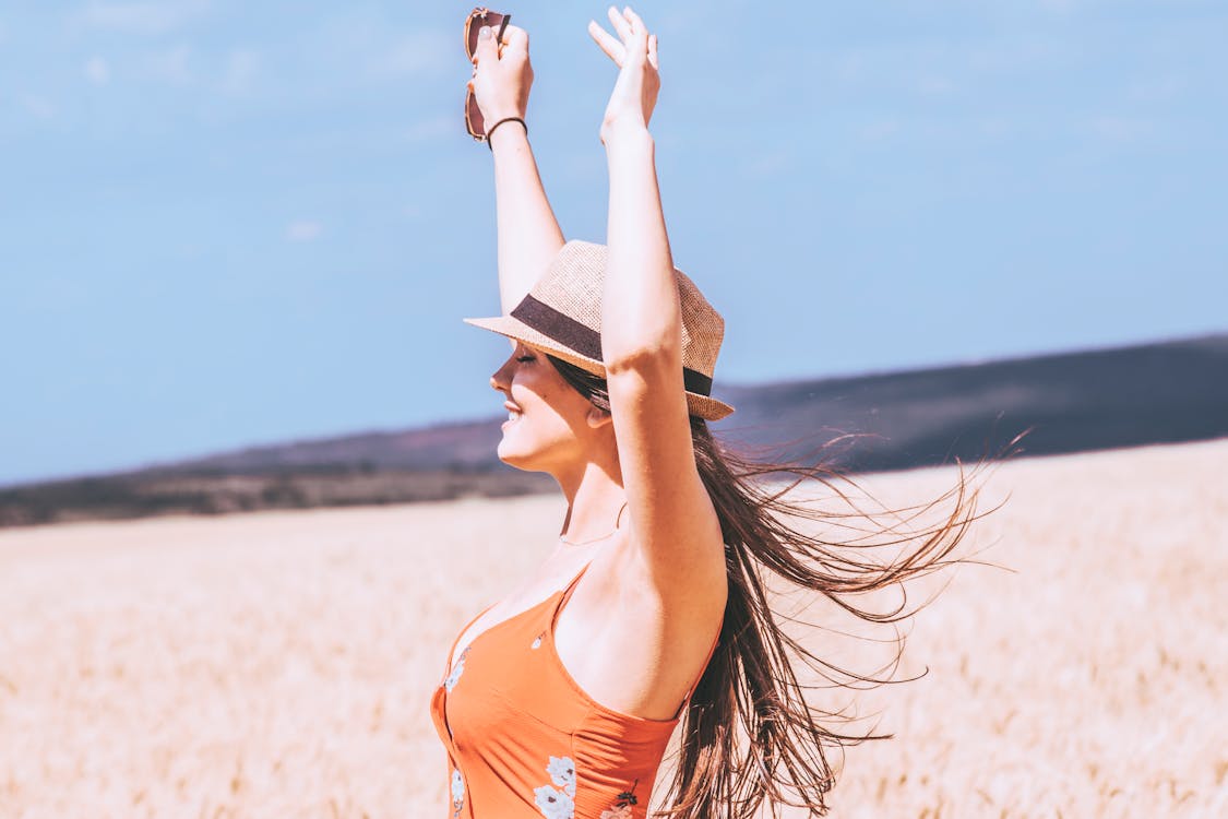 Free Photo of Woman Raising Her Both Arms Stock Photo