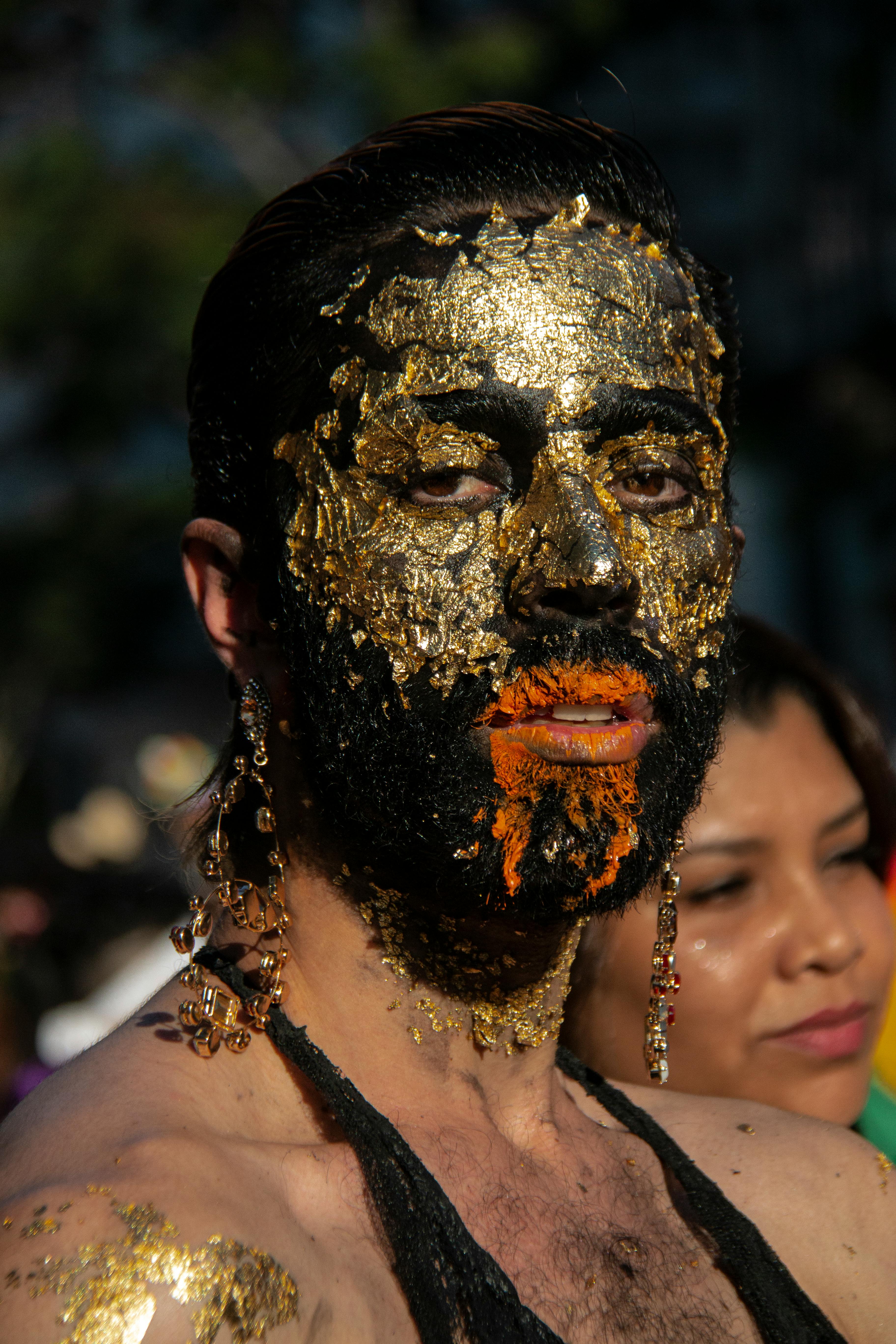 woman wearing gold mask