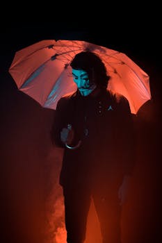An enigmatic figure wearing a mask and holding an umbrella, backlit with dramatic lighting in Jaipur.