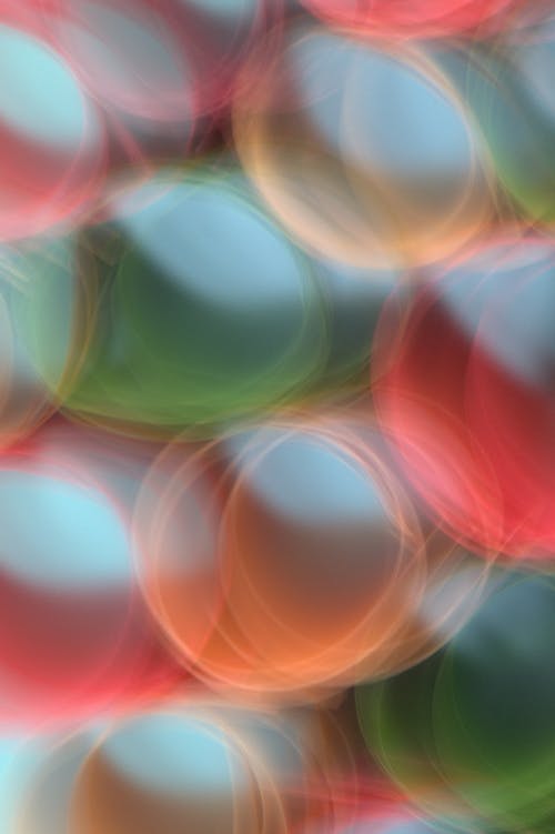 A colorful abstract background with a red, green and blue ball