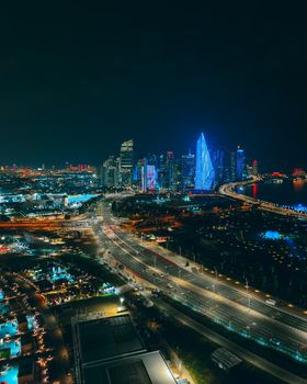 A breathtaking aerial view of Doha's illuminated skyline at night showcasing modern architecture.