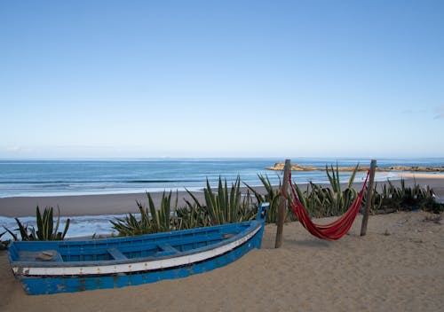 Photo of a Blue Gondola on the Seashore