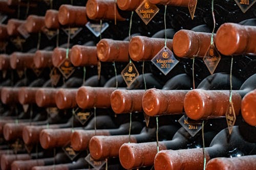 Close-Up Photo of Brown Labeled Bottles