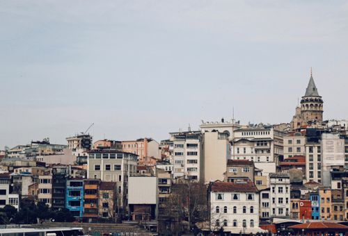 Free A beautiful cityscape featuring the iconic Galata Tower amid urban Istanbul architecture. Stock Photo