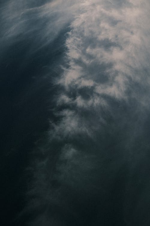 A photo of a plane flying through the clouds