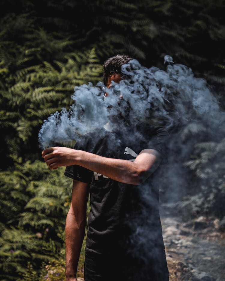 Man Holding Smoke Bomb