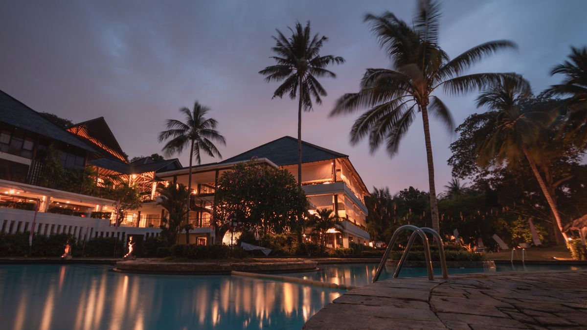 Hotel building exterior lit up at night when late arrivals are most likely to be walked