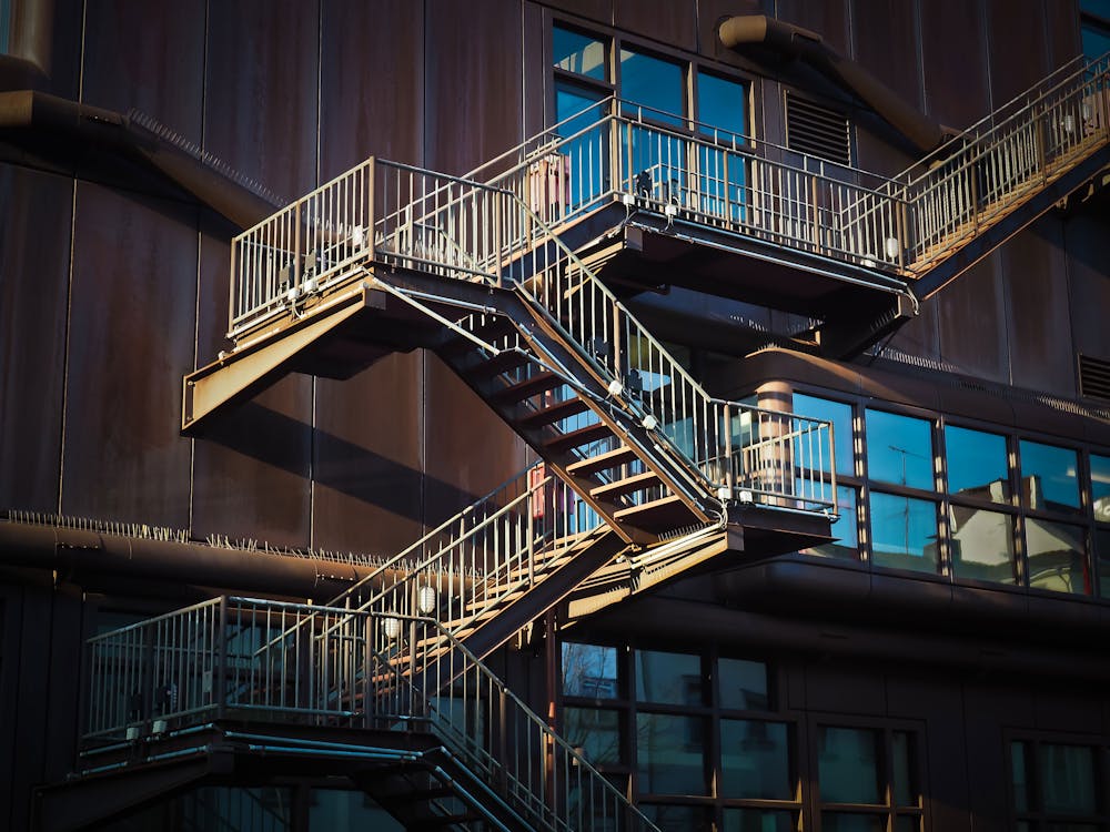Free Low Angle View of Spiral Stairs Stock Photo
