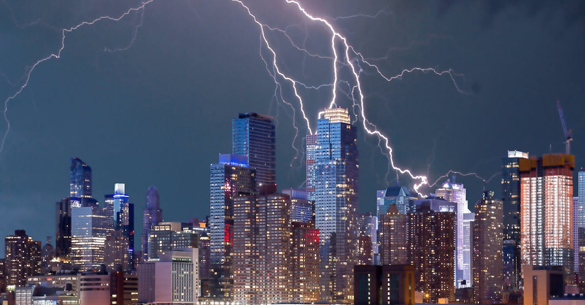 Photo by Pixabay Thrilling lightning storm over a bustling urban skyline at night with stunning reflections on the waterfront.
