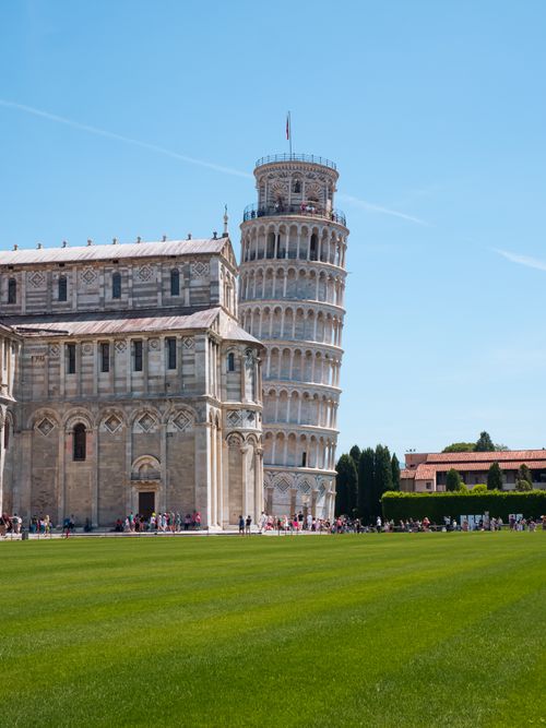 Free Leaning Tower of Pisa and cathedral in summer daylight, iconic Tuscany landmark. Stock Photo