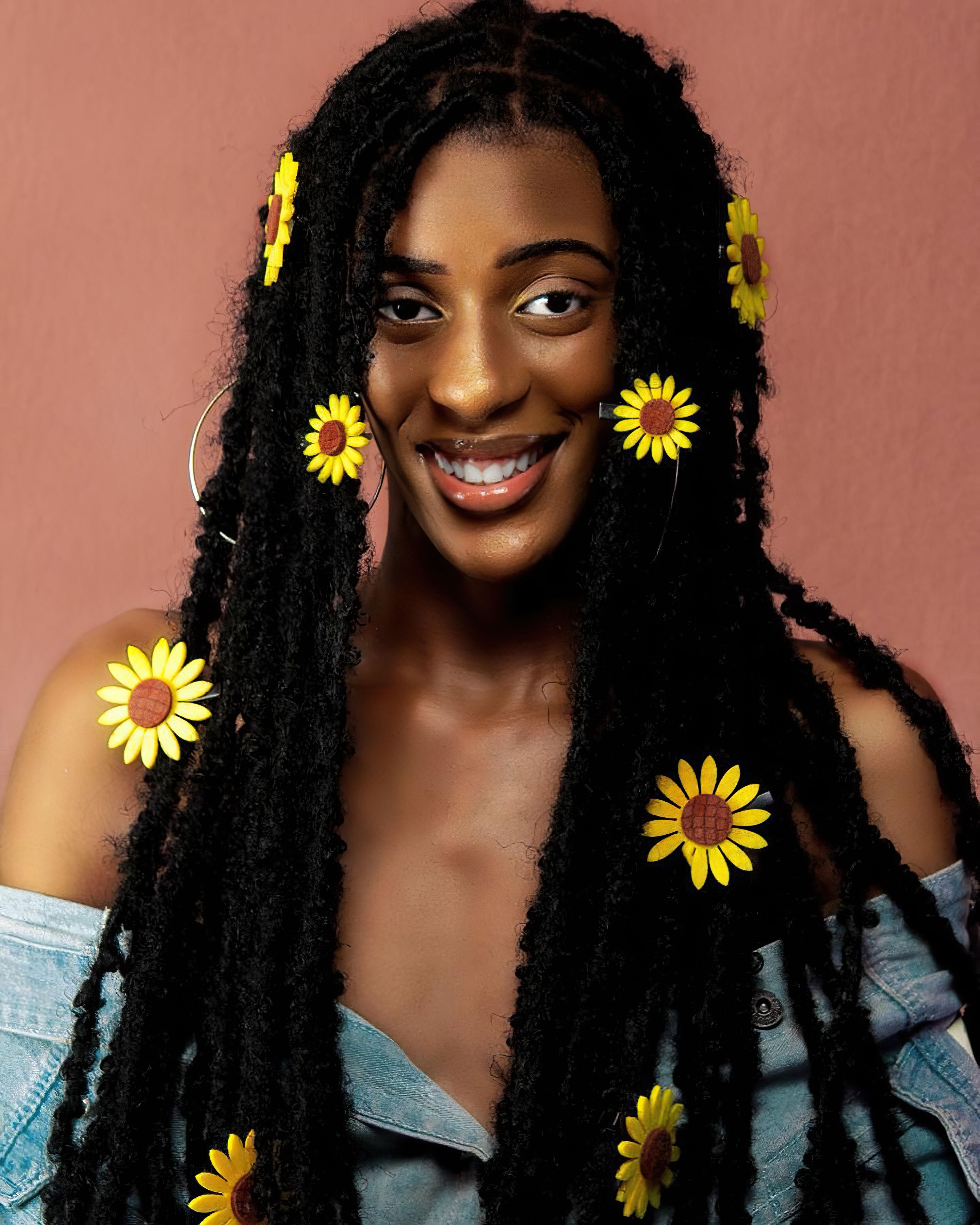 Portrait of a Young Woman with Flowers in Her Hair · Free Stock Photo
