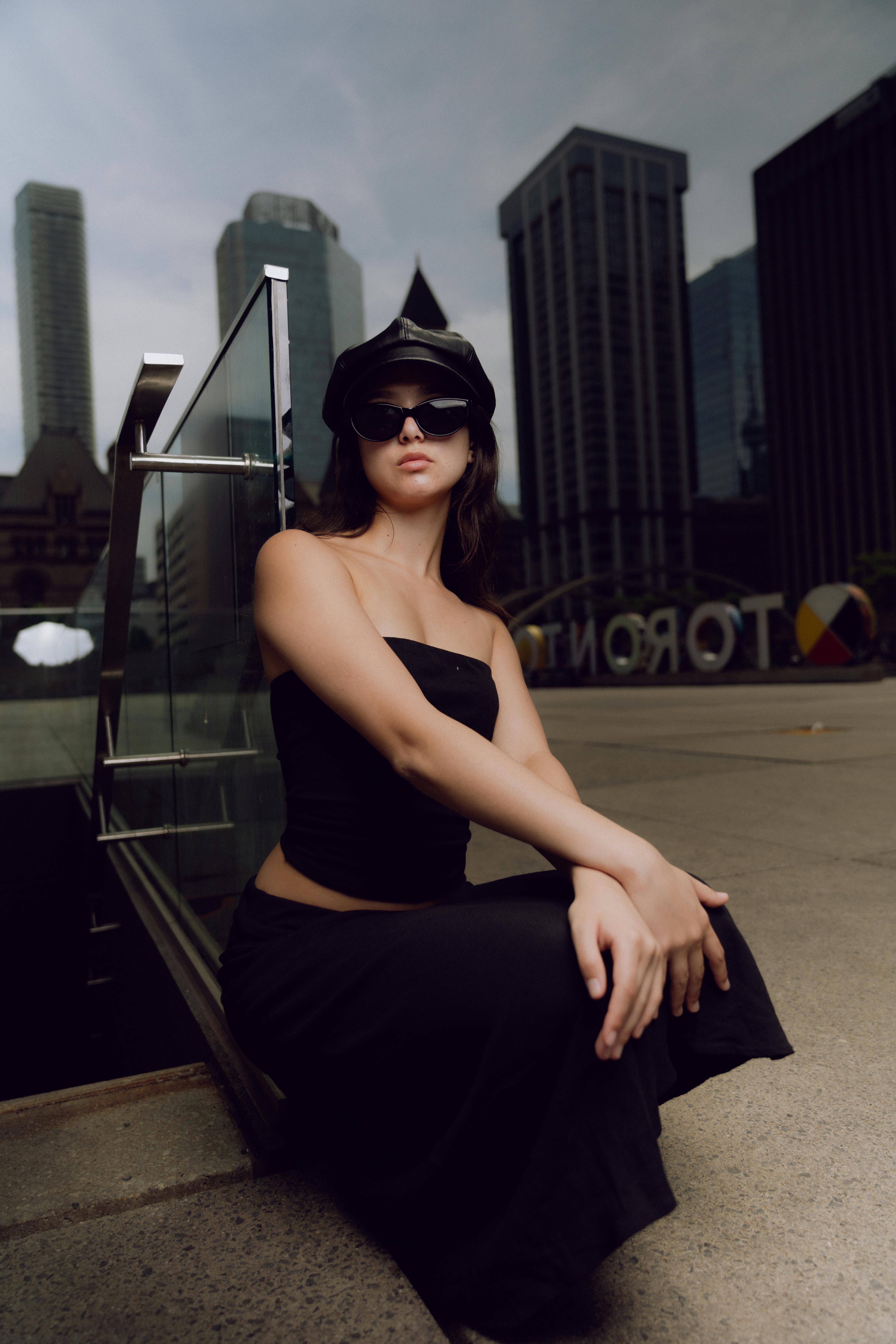 woman posing in black clothes on a roof