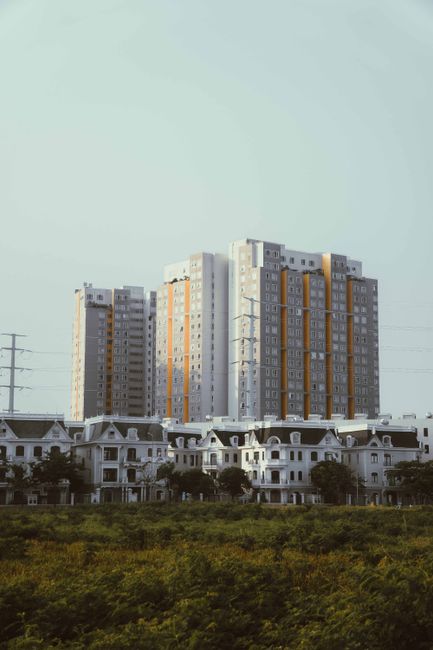 View of modern residential buildings amidst greenery in Ho Chi Minh City.