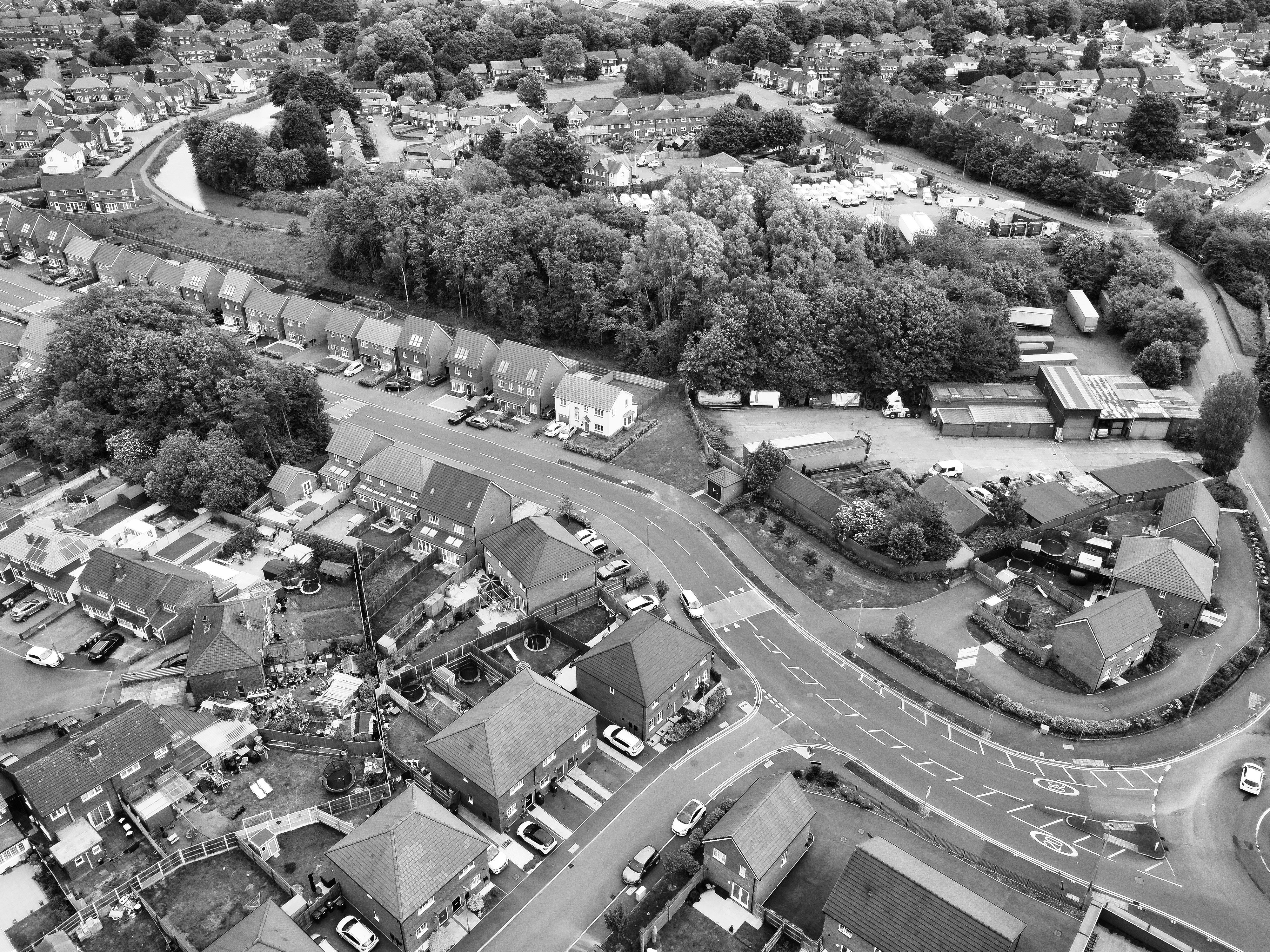 Black and white aerial photo capturing a suburban area in West Midlands, England.