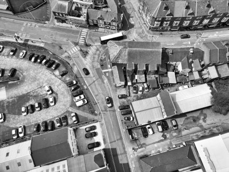 Black and white aerial shot showcasing cars, streets, and buildings in West Midlands, England.