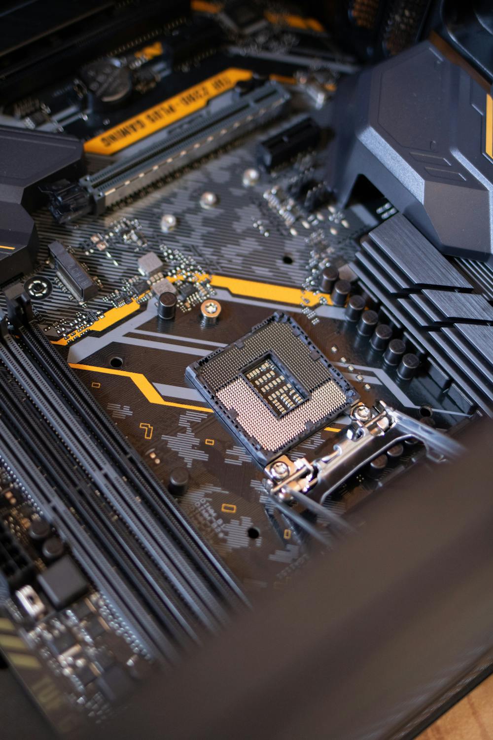 Image of a motherboard of a computer with an empty CPU slot