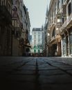 Gray Concrete Road Between Buildings