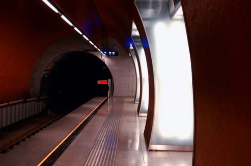 Free A modern and illuminated metro station tunnel with an empty platform and sleek architecture. Stock Photo