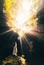 Photo of a Woman Standing in a Cave