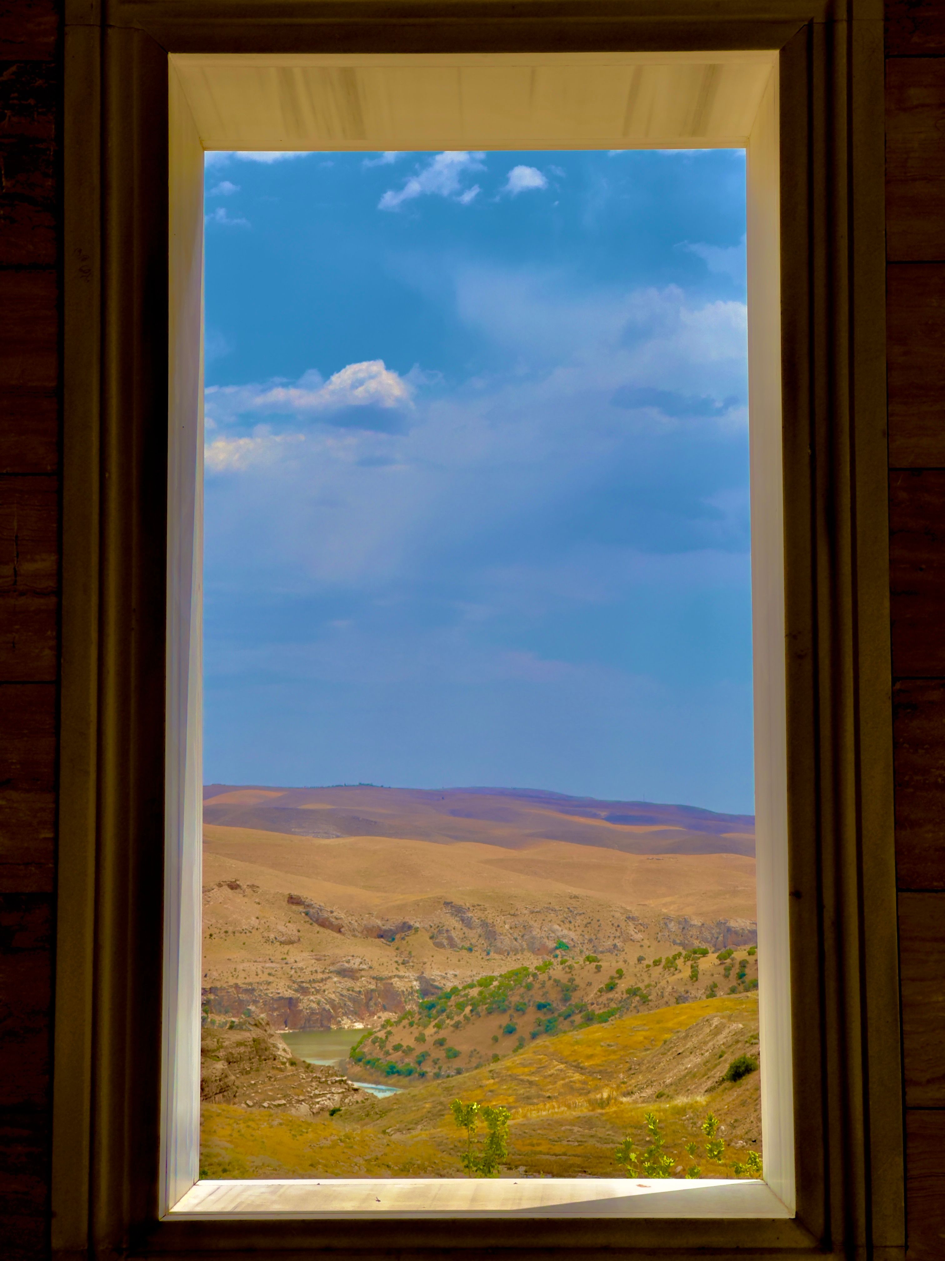 Hills in Countryside behind Window of Room · Free Stock Photo