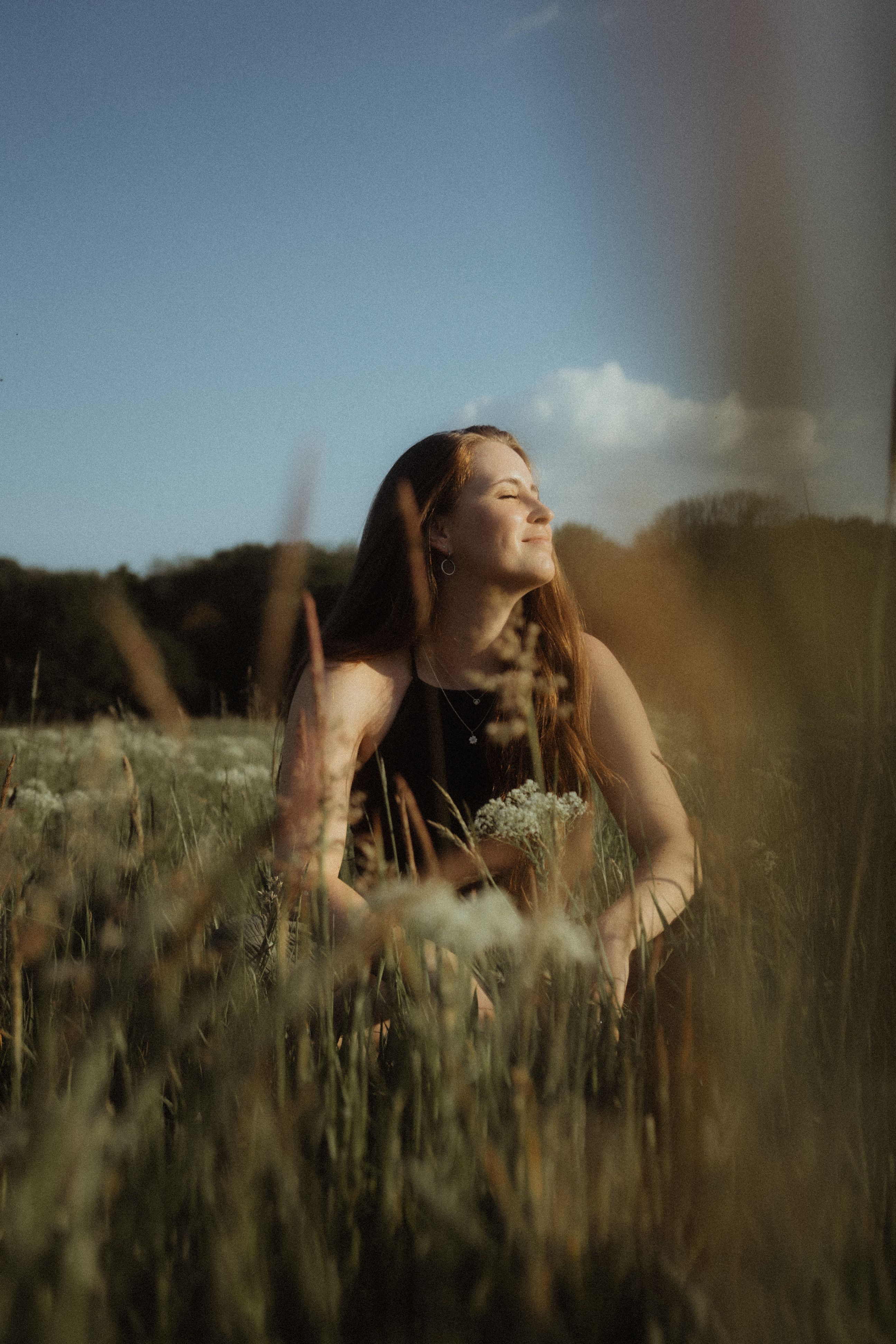 Woman with Eyes Closed among Flowers on Meadow · Free Stock Photo