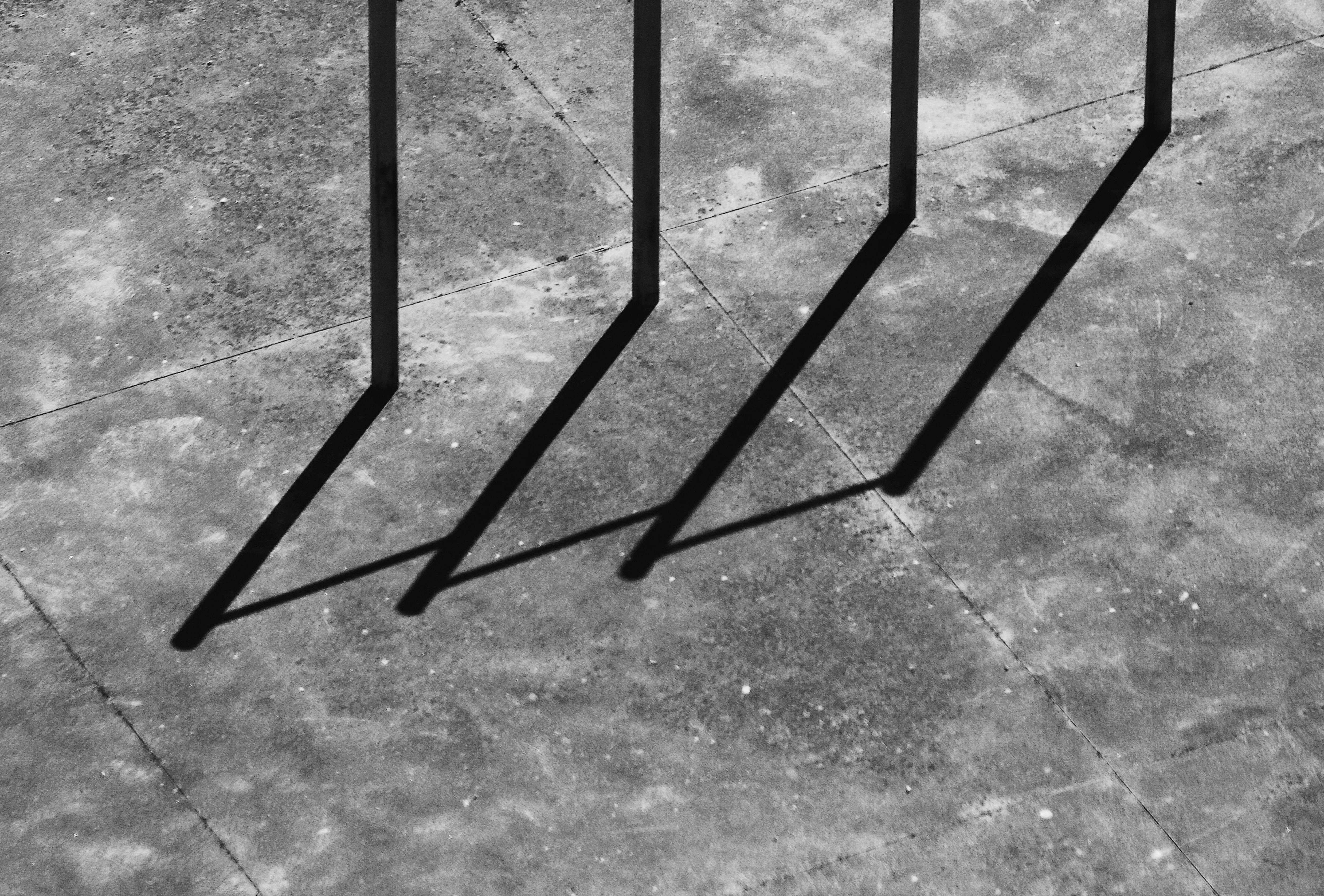 Free Artistic capture of shadows on pavement in Porto, Portugal, highlighting urban geometry. Stock Photo