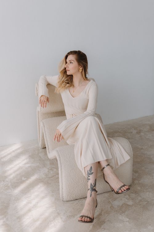Woman in a cream bouclé shift dress