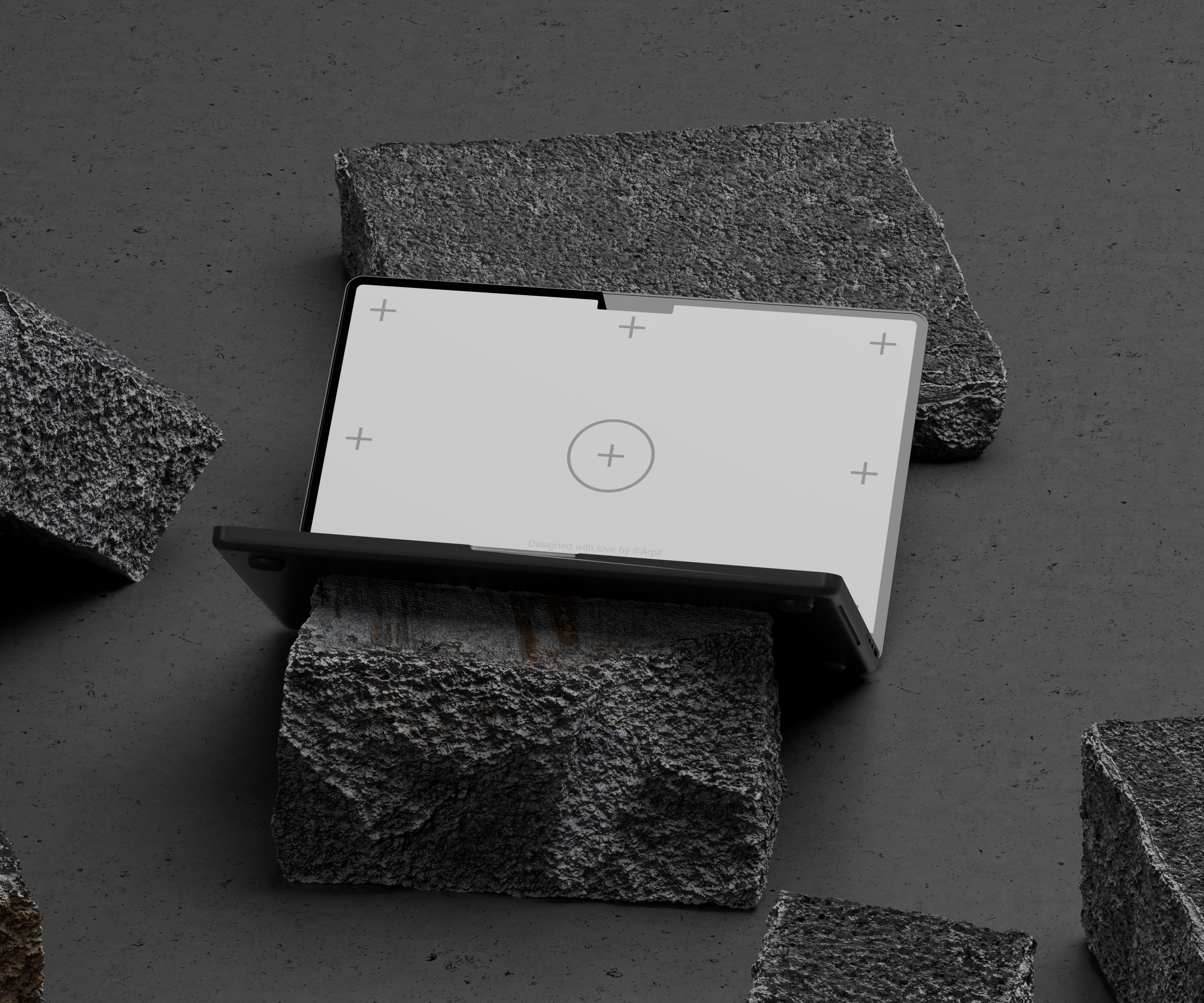 A sleek laptop with calibration screen, placed on rough stones against a gray background.