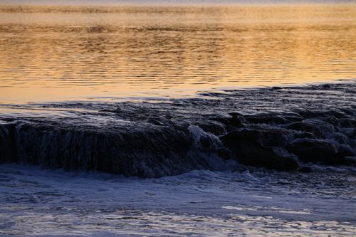 Free Tranquil ocean waves at sunset in Stamford, Connecticut, creating a picturesque seascape view. Stock Photo
