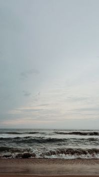 Peaceful ocean waves with a beautiful sky at twilight. Ideal for relaxation themes.