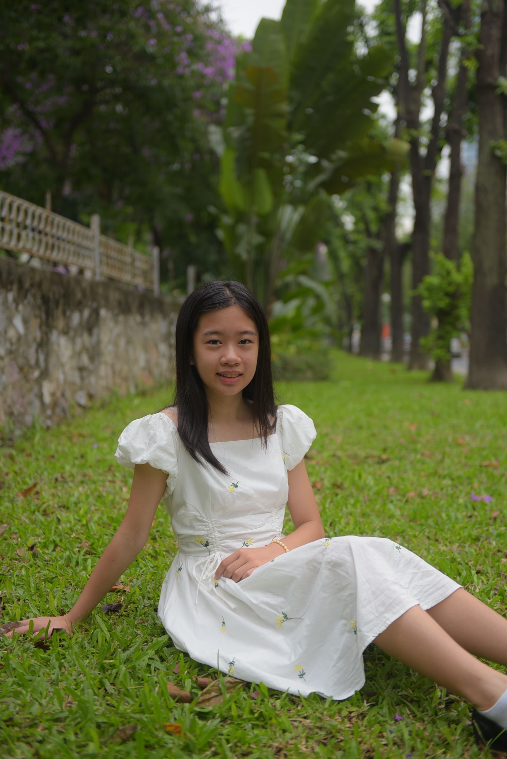 Girl in a White Dress Sitting on the Lawn · Free Stock Photo
