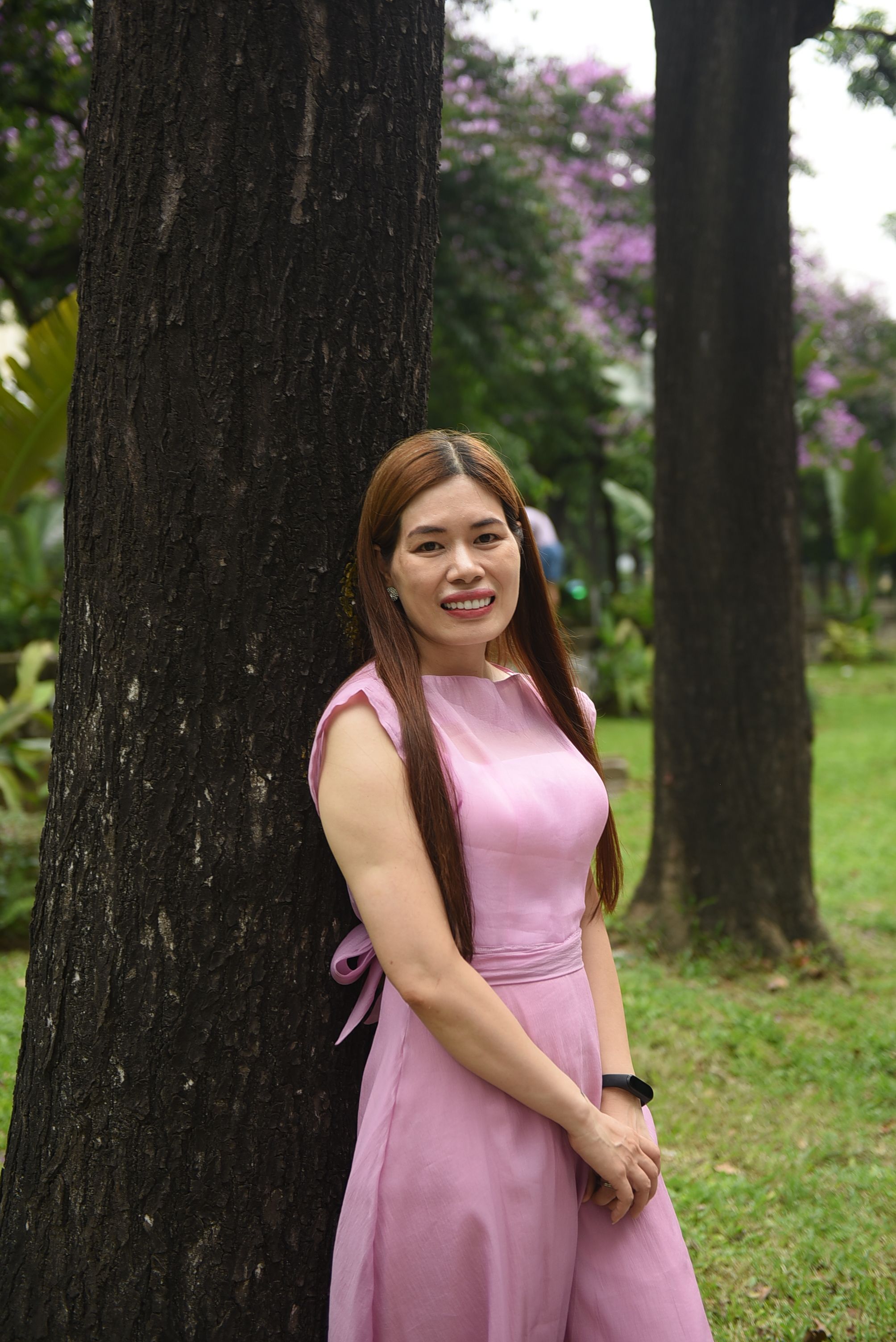 Model in Pink Dress Standing Under a Tree · Free Stock Photo