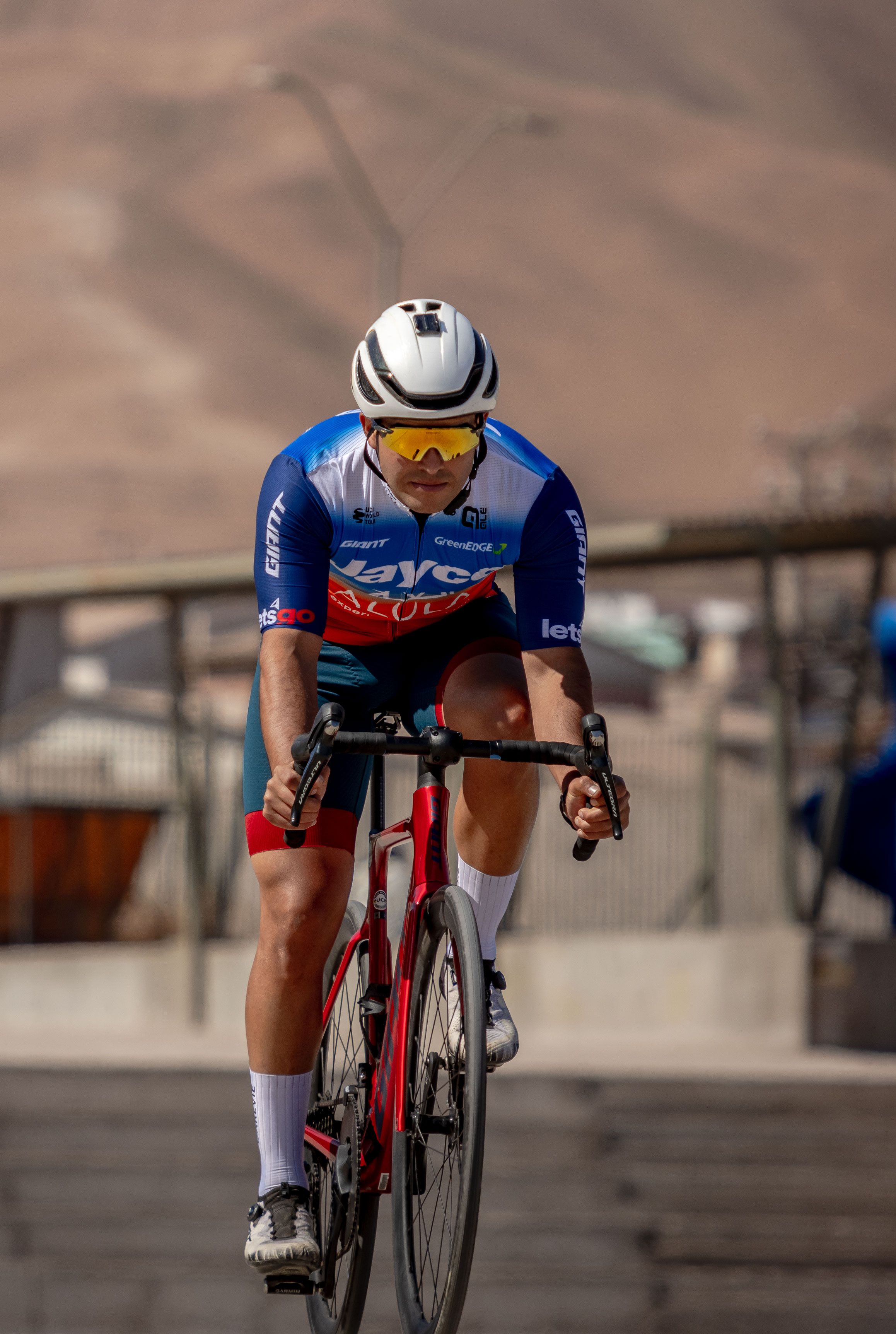 Focused cyclist racing outdoors in Alto Hospicio, Chile, showcasing intense sportsmanship.