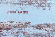 Visitor Parking Text Painted on Stonewall