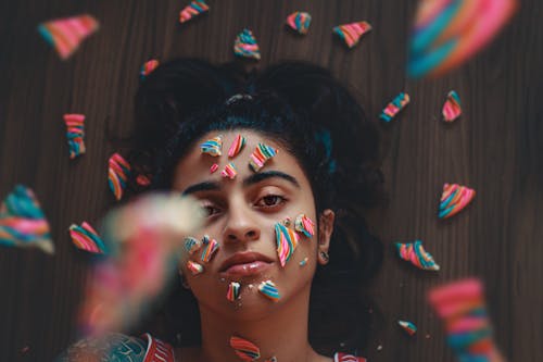 Photo Of Woman With Candies On Her Face