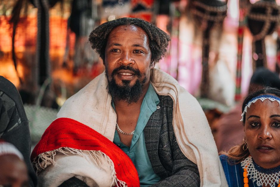 What traditional clothing do you associate with this person's look?